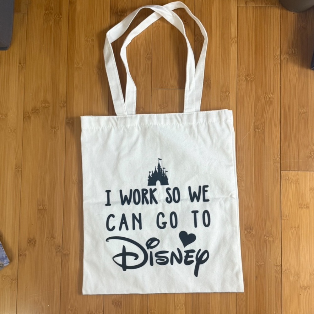 “I work so we can go to Disney” white canvas tote bag, new